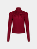 Draped ruby turtleneck