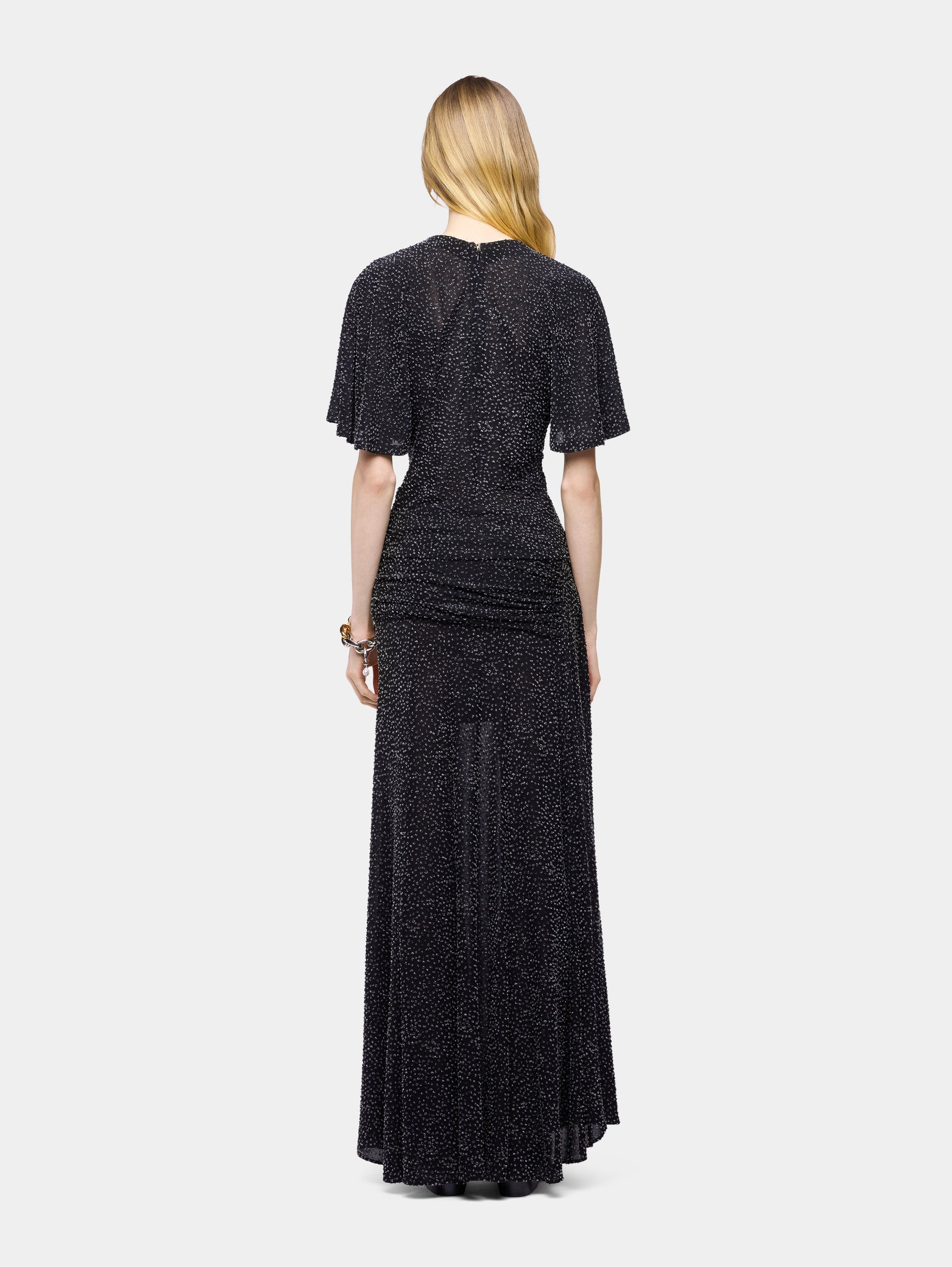 Long black textured asymmetrical skirt with ruched details