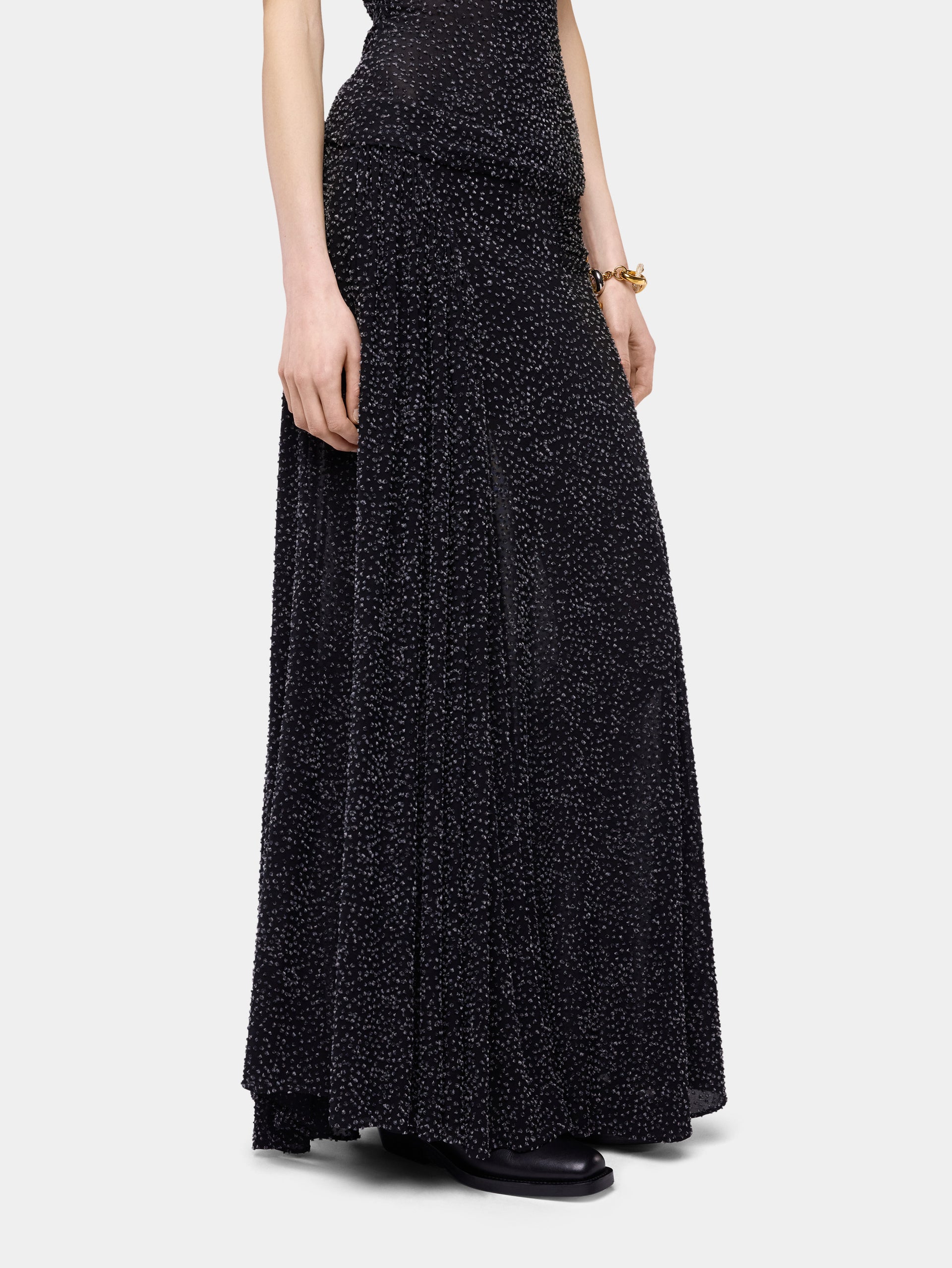 Long black textured asymmetrical skirt with ruched details