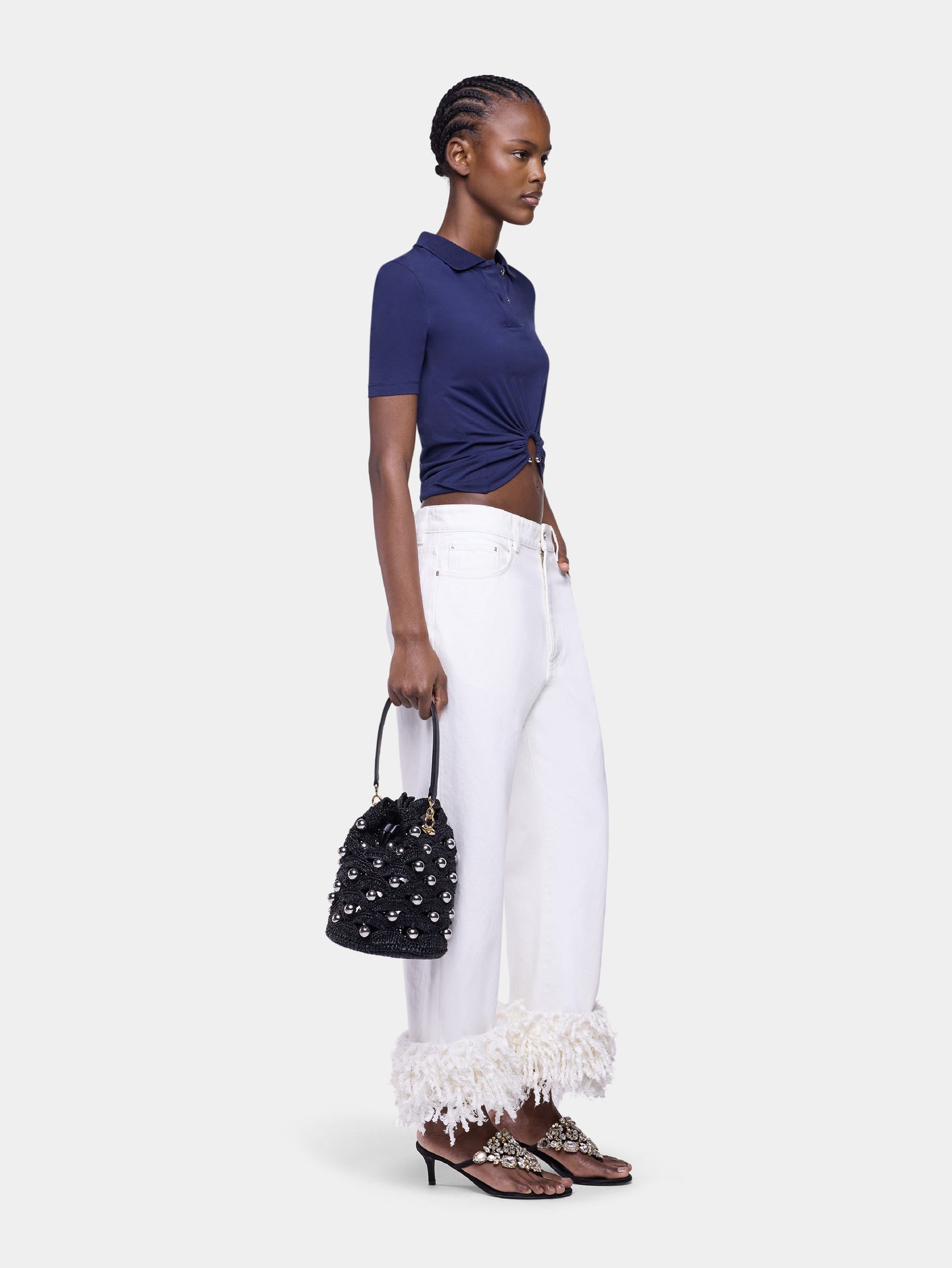 Small bucket bag in black raffia with silver pearls details