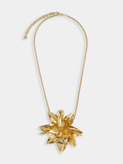 Necklace with gold metal flower pendant