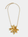 Necklace with gold metal flower pendant