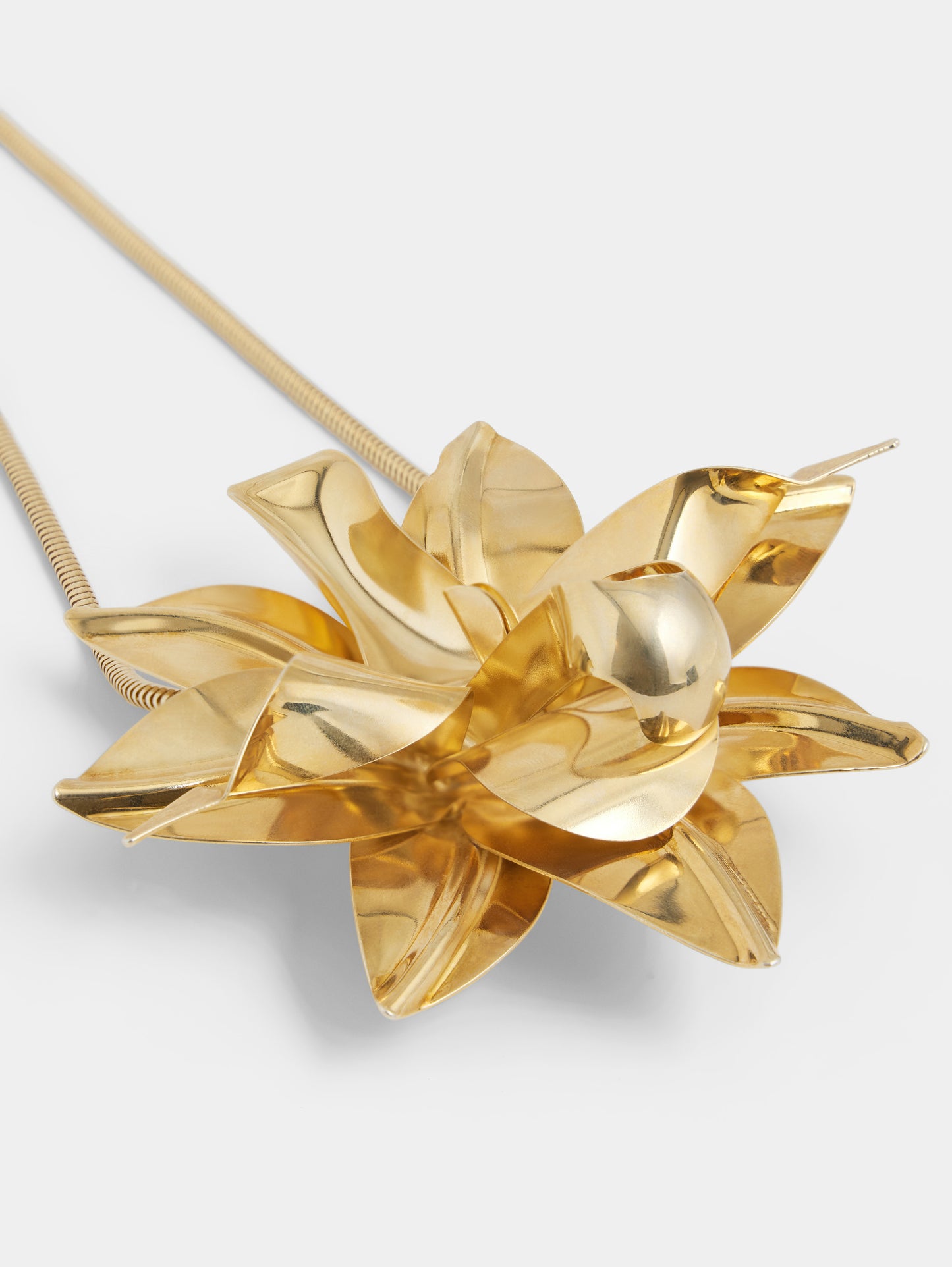 Necklace with gold metal flower pendant