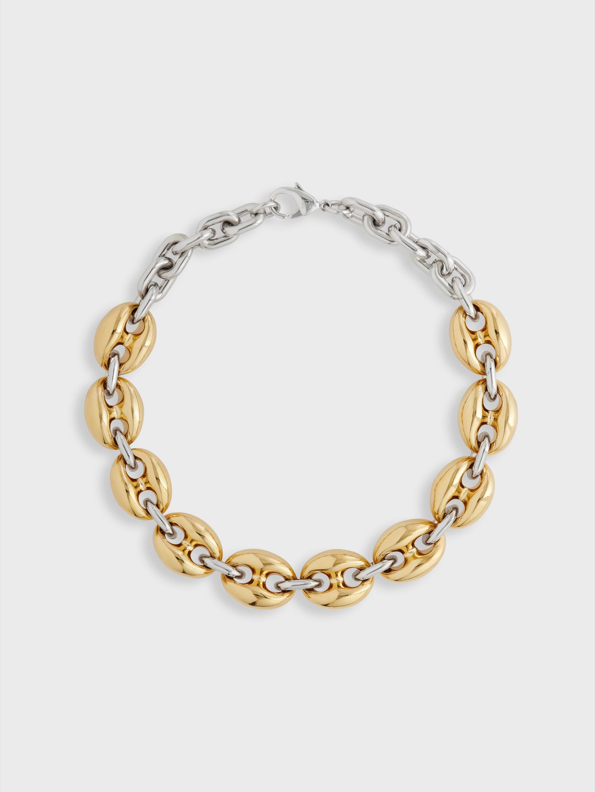 Eight chunky gold/silver necklace position 1