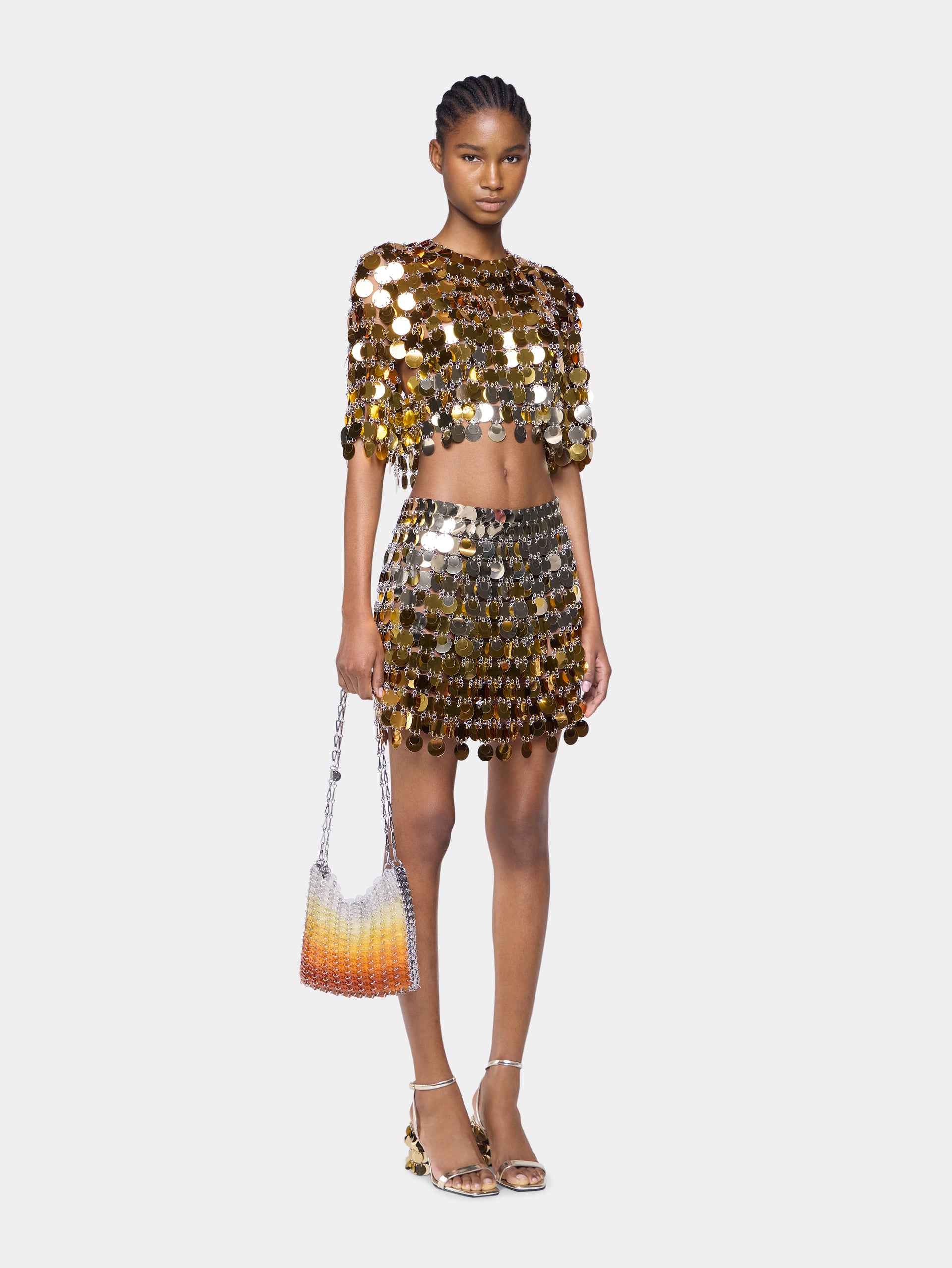 Gold mini skirt in gradient assembly position 2