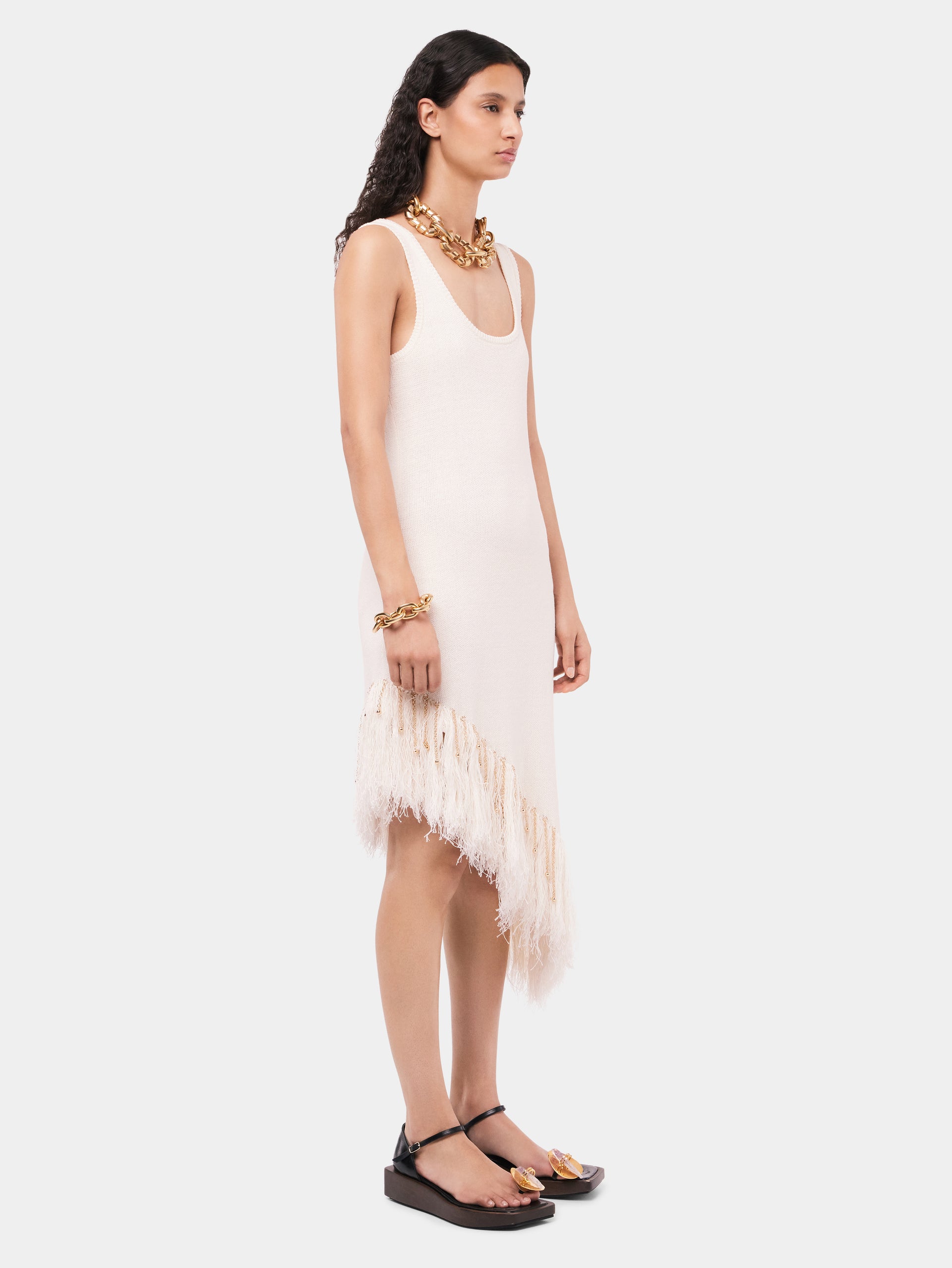 Asymmetrical off white woven dress with knitted beads and feathers