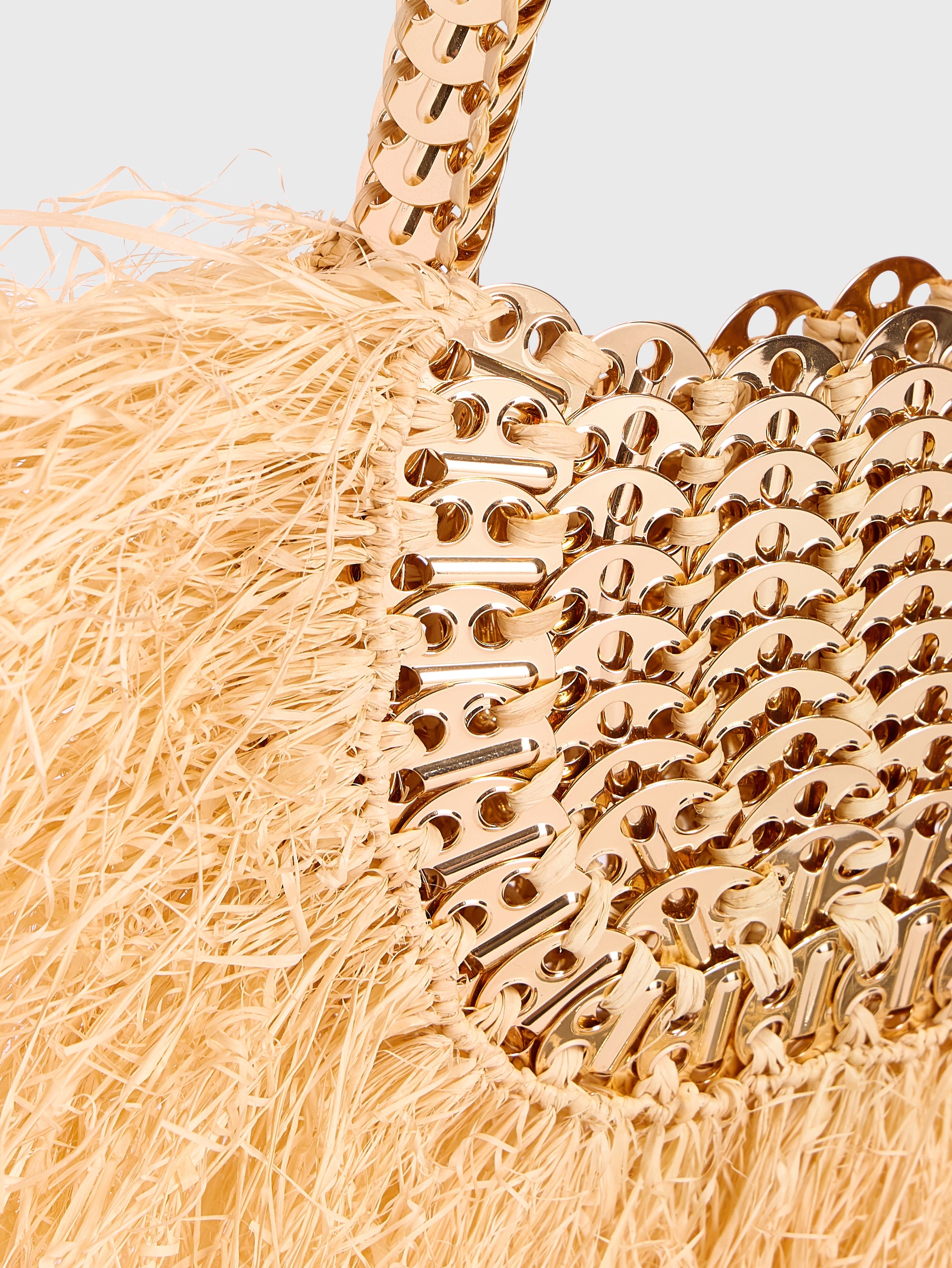 Iconic 1969 moon bag with natural raphia fringes