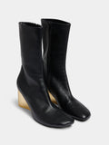 Short black boots with gold base