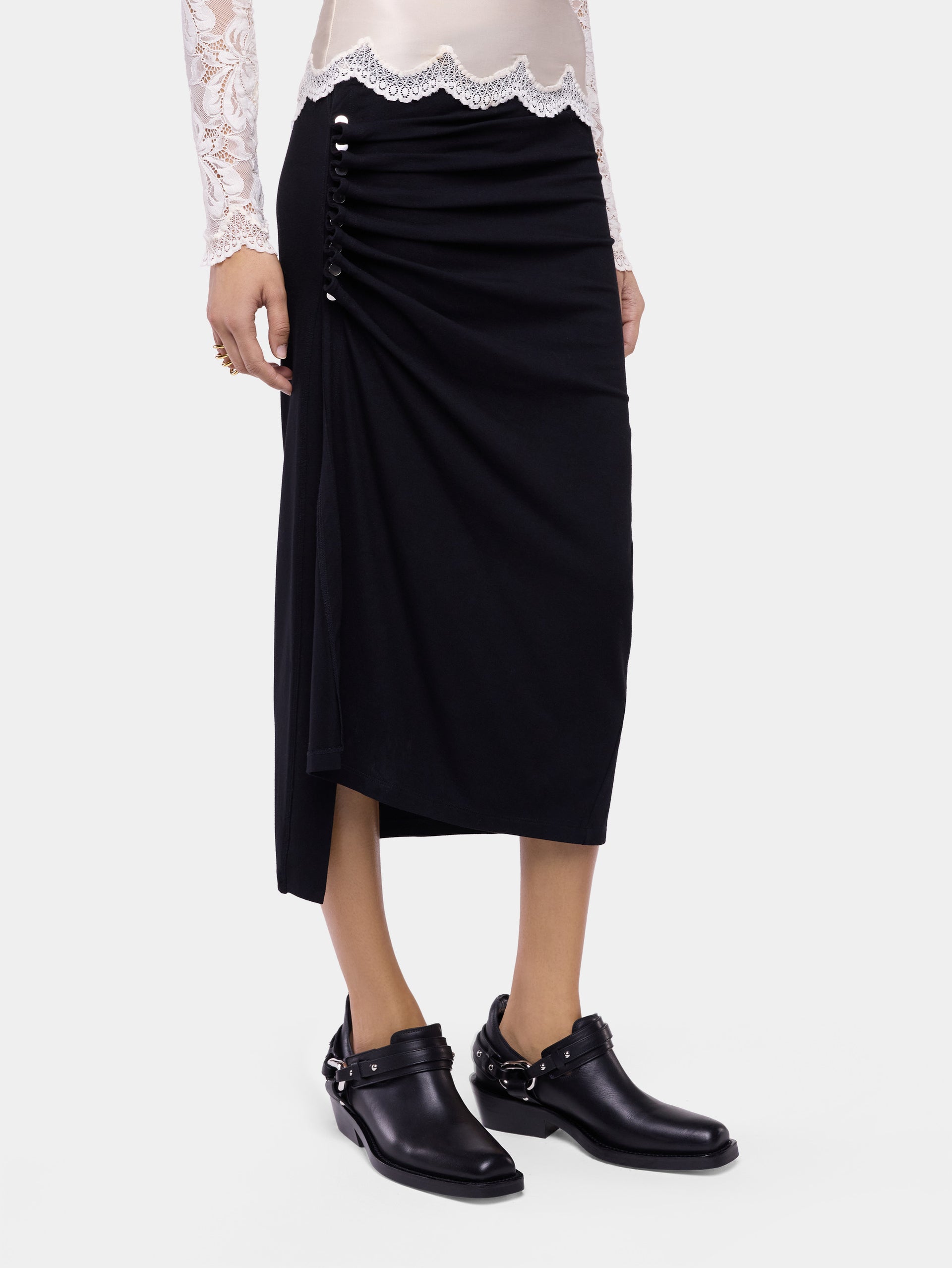 Jupe midi en jersey noir avec détails de drapé