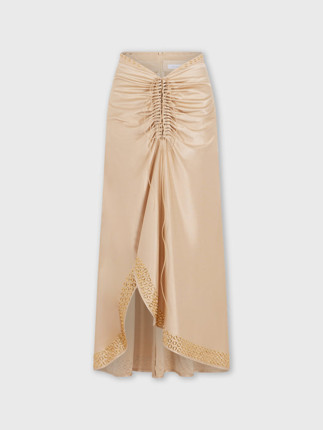 Long raffia colored skirt with embroidered metallic eyelets