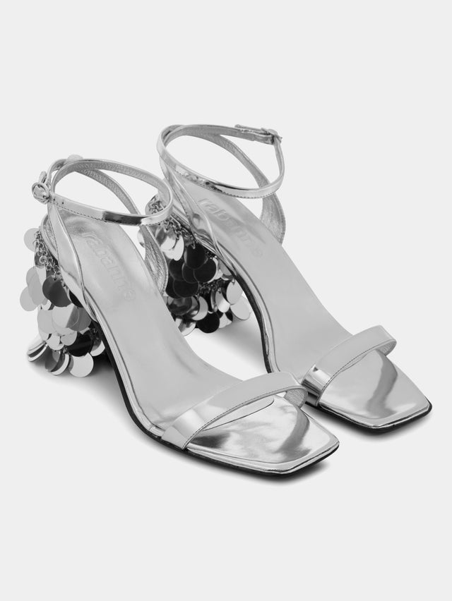Silver sandals with sparkle discs heels