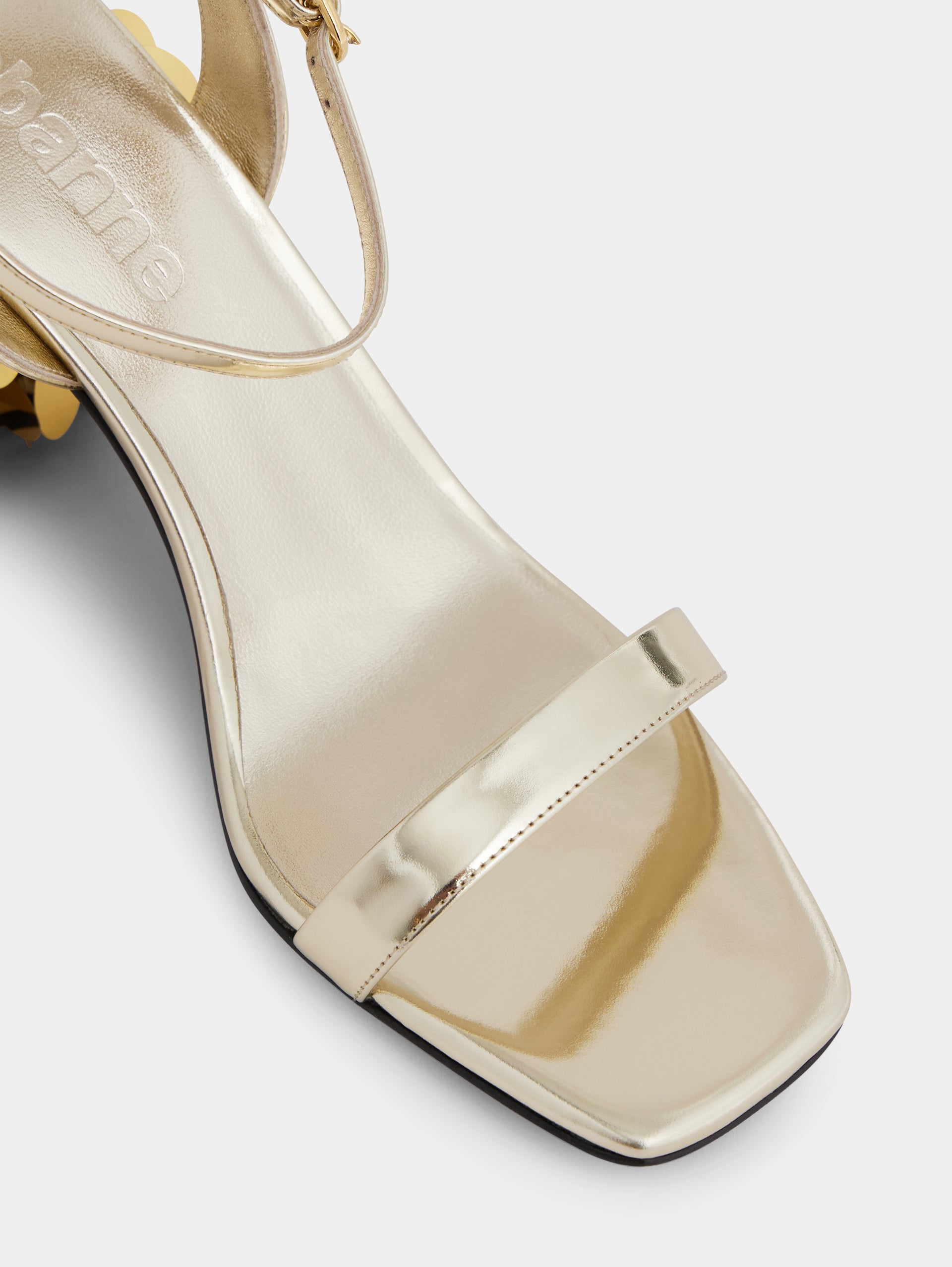 Gold sandals with sparkle discs heels