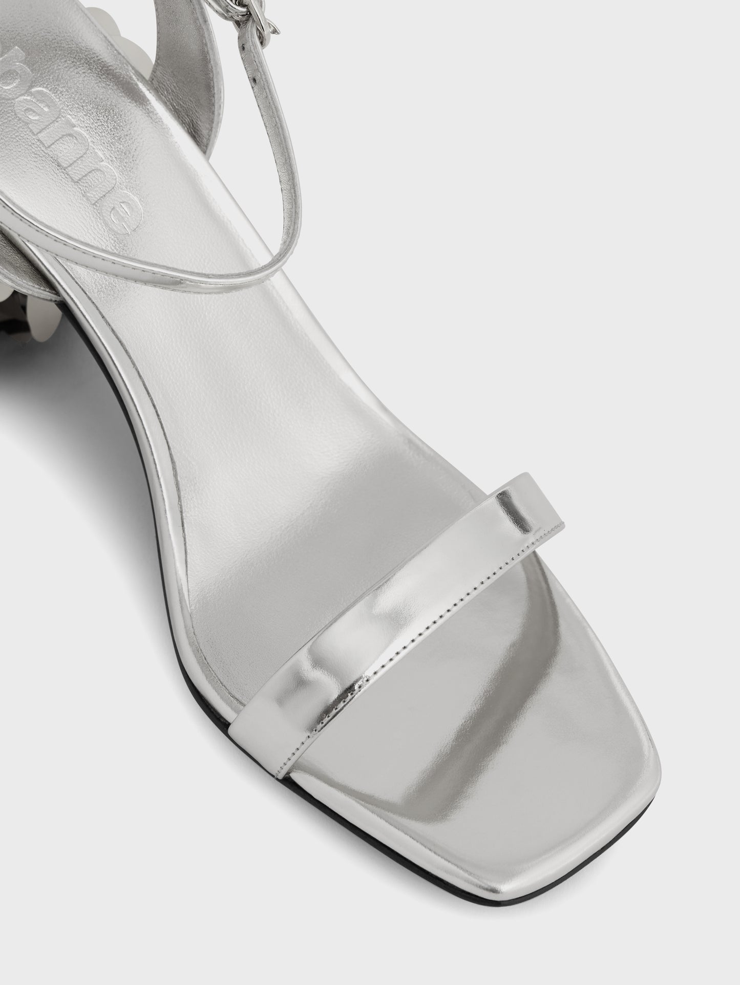 Silver sandals with sparkle discs heels
