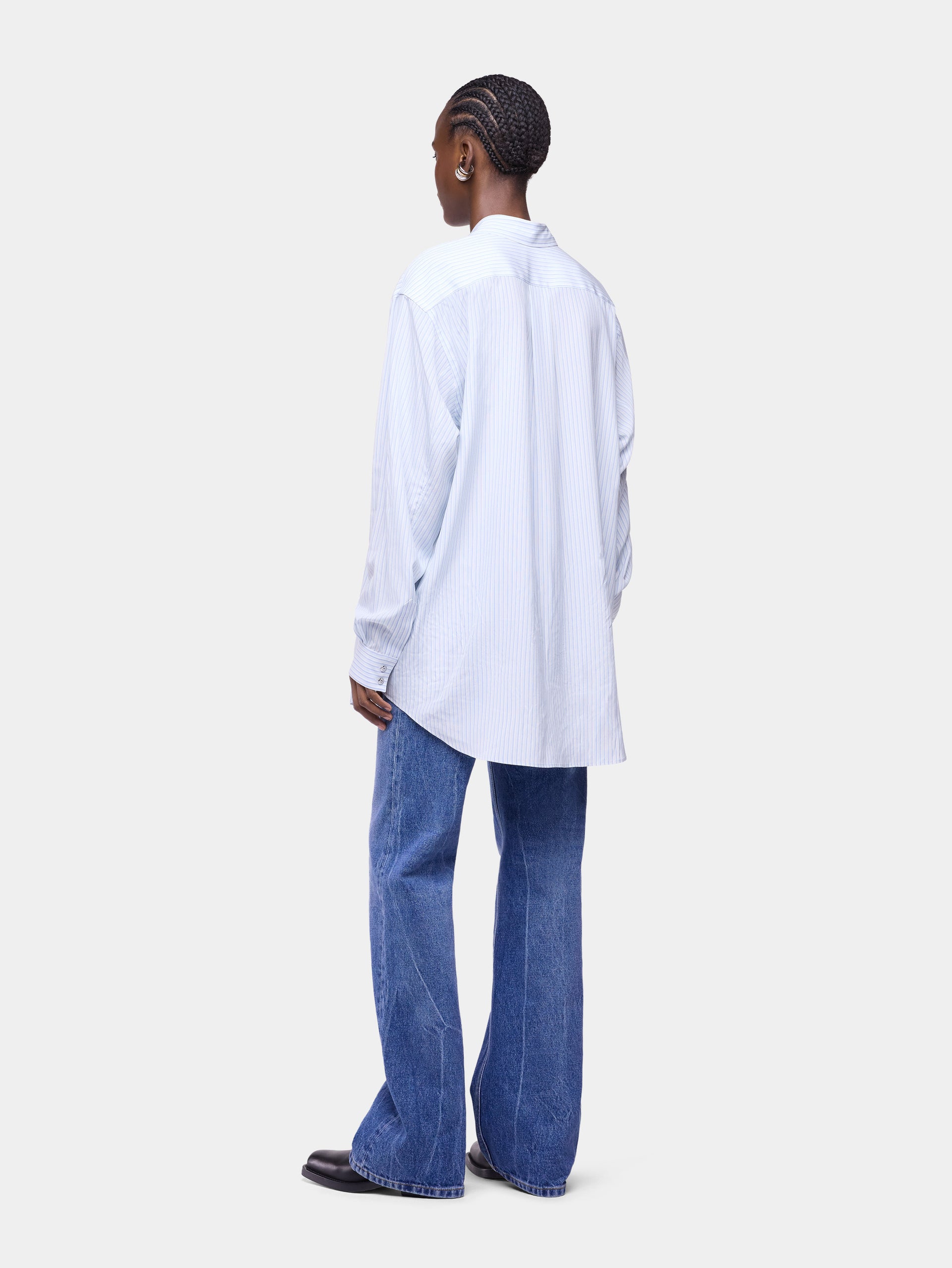 Jean droit en denim délavé avec franges 