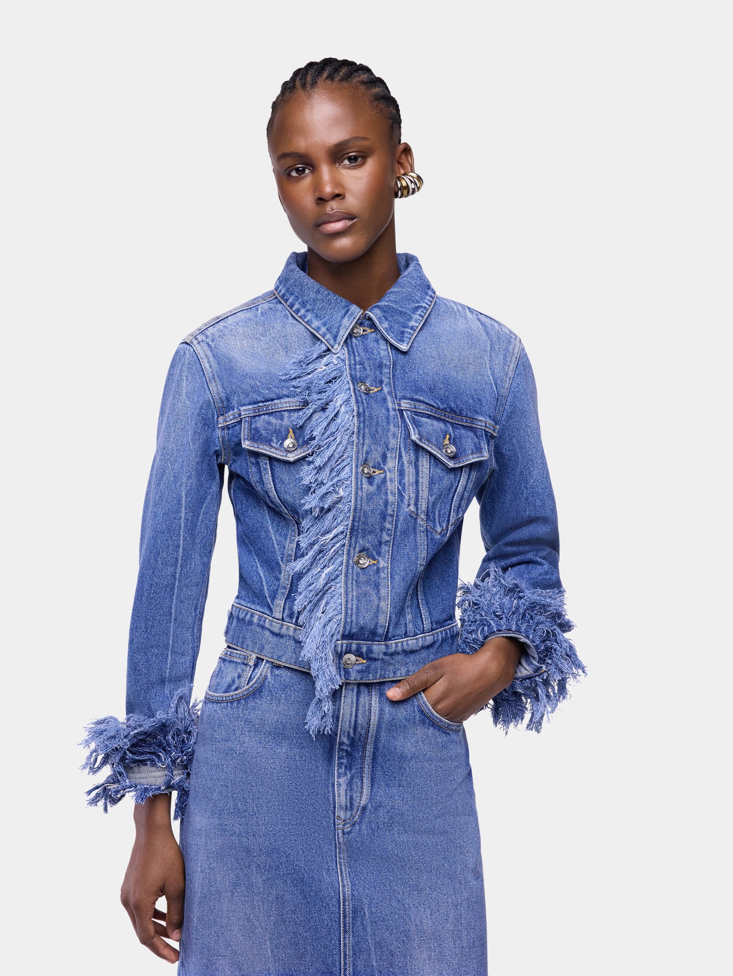 Fitted blue washed denim jacket with fringes