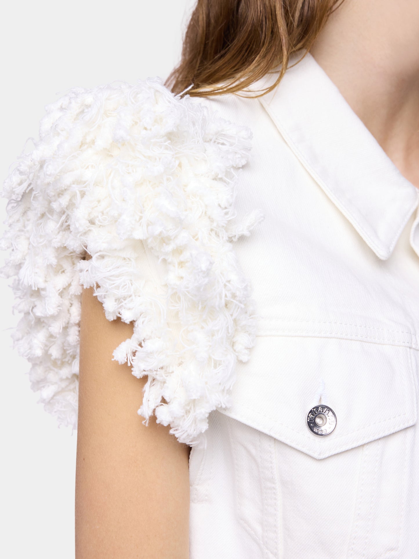 Veste en denim blanc ajustée avec franges 