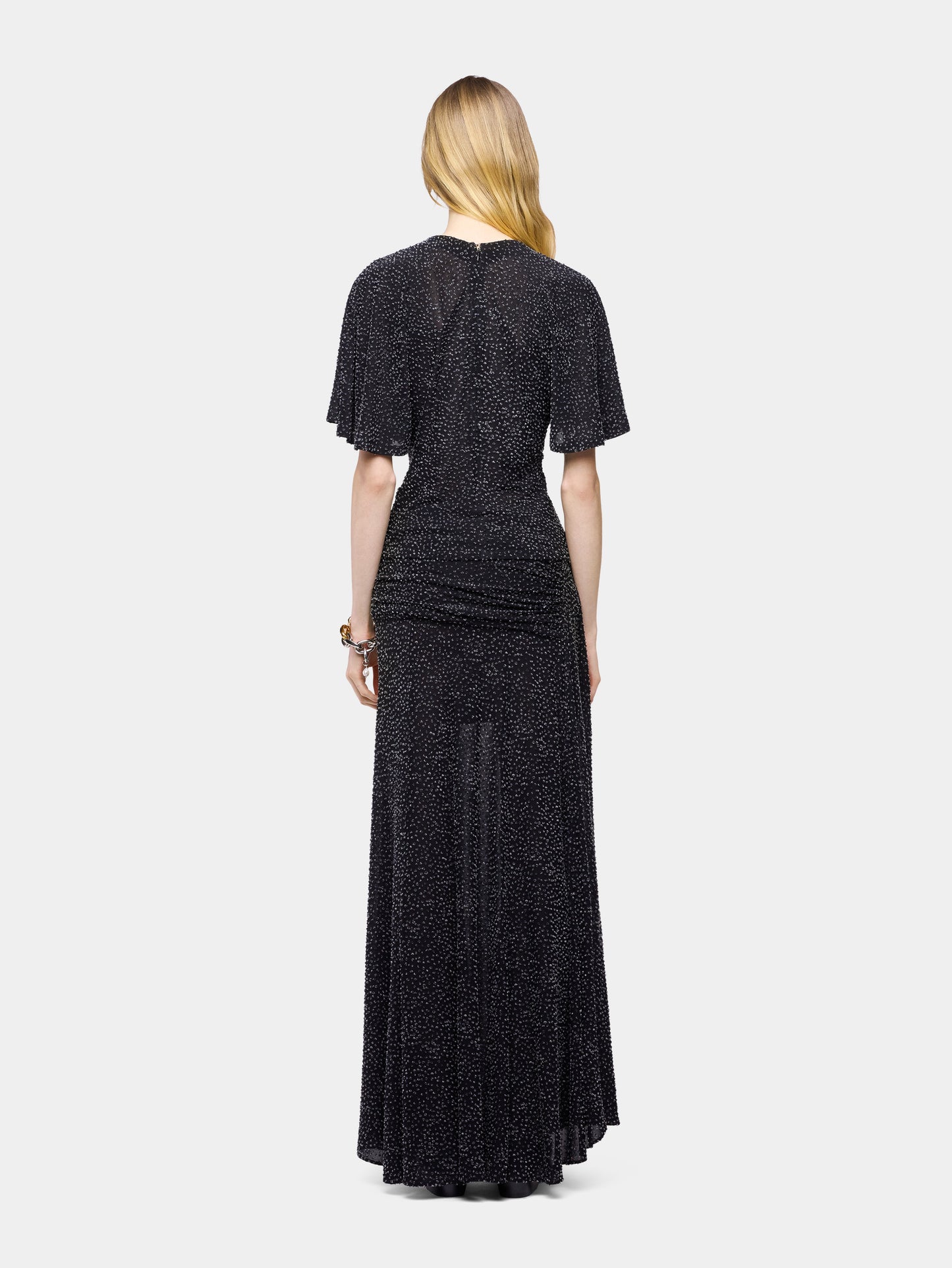 Long black textured asymmetrical skirt with ruched details
