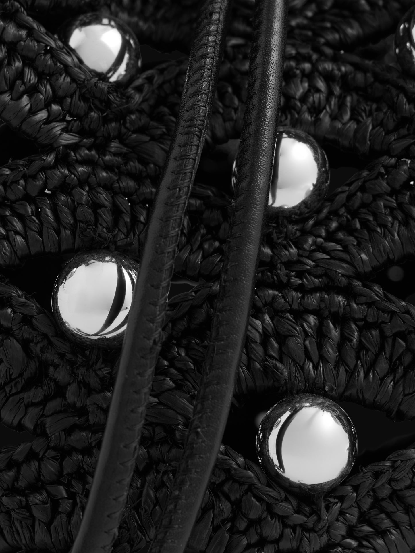 Small bucket bag in black raffia with silver pearls details