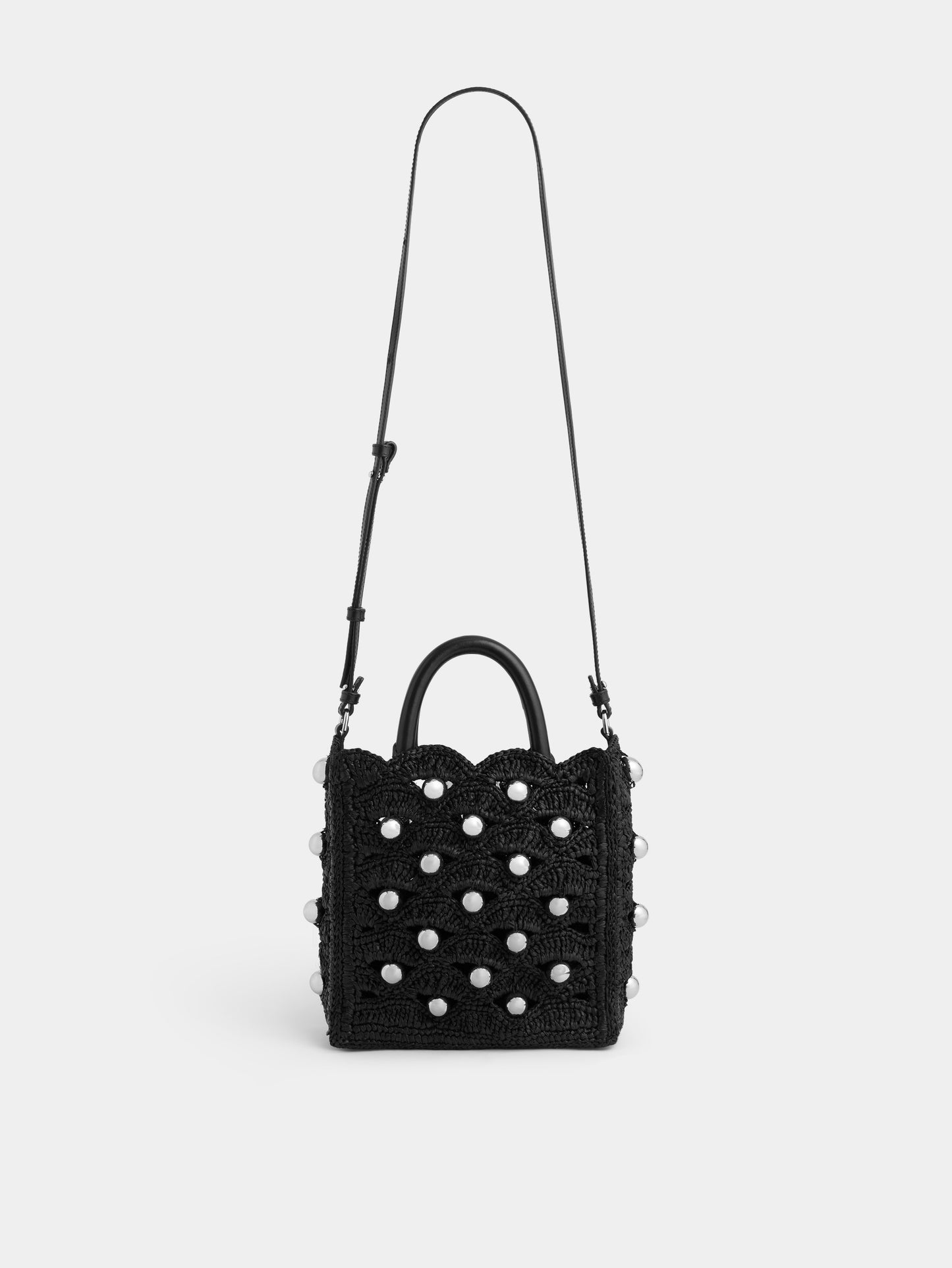 Small tote bag in black raffia with silver pearls details