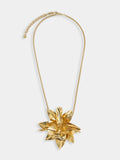 Necklace with gold metal flower pendant