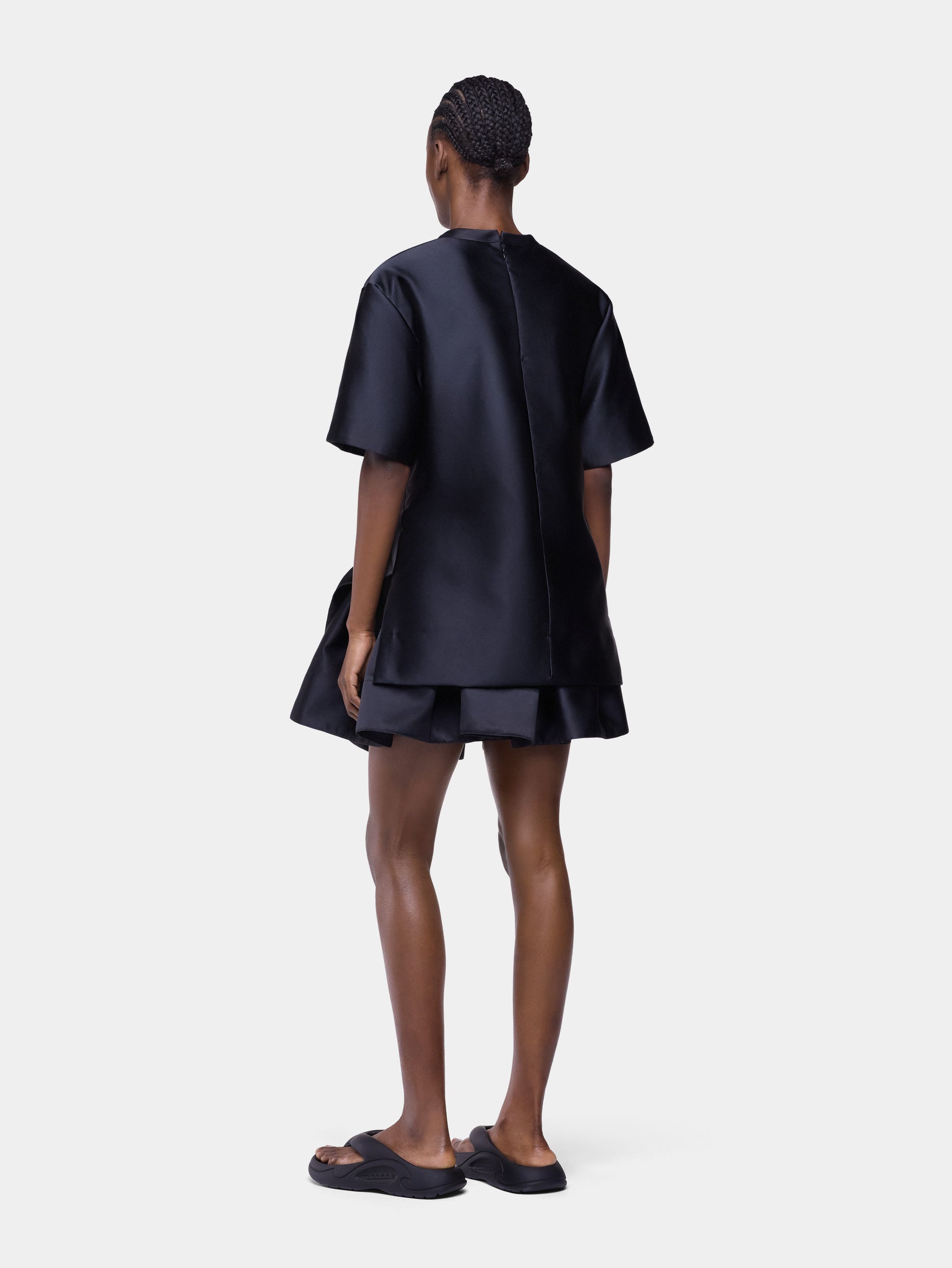 Tailored top in black satin with bow detail