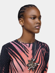 Necklace with silver metal flower pendant