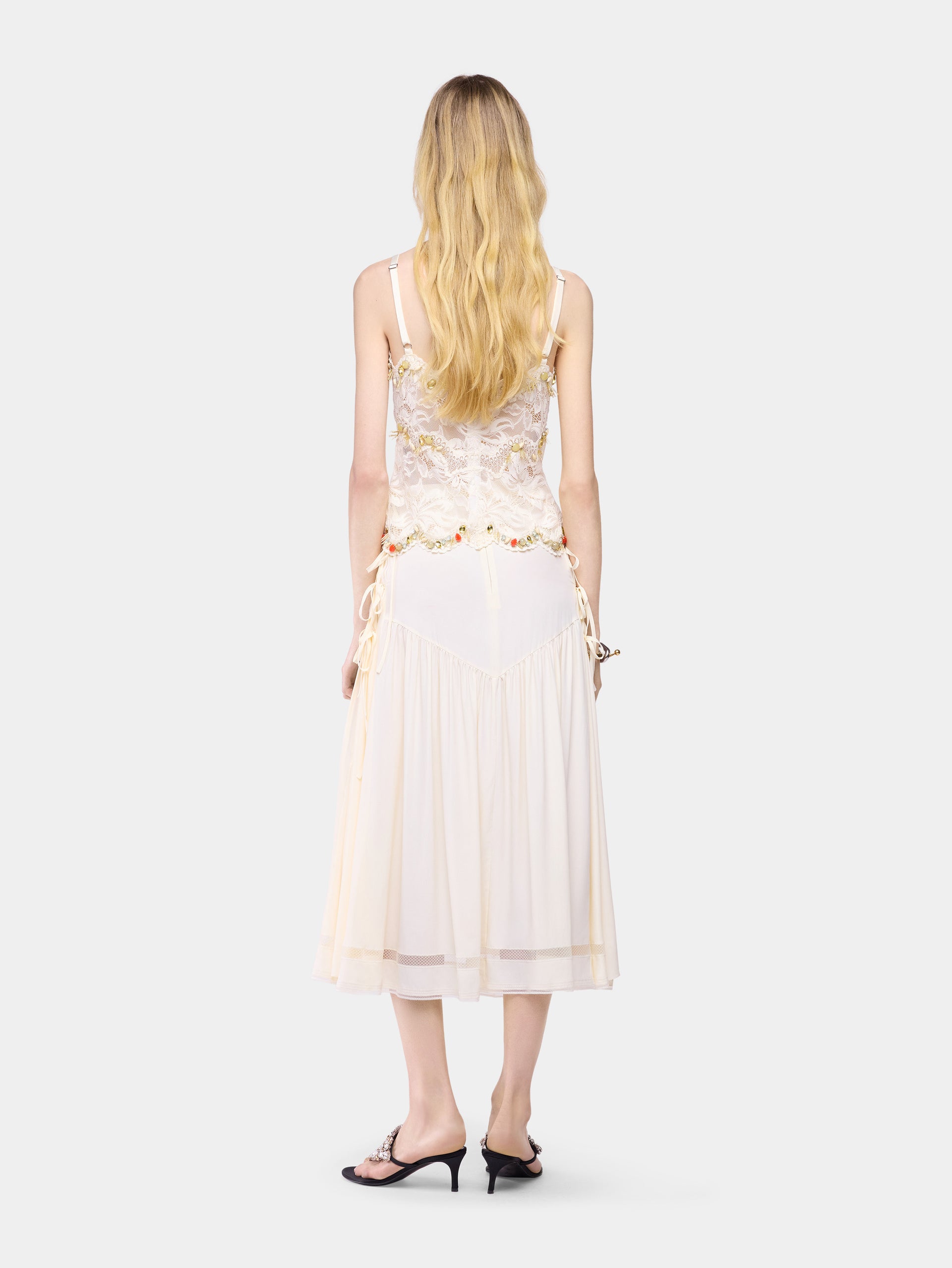 Sleeveless top in off white hand embroidered lace