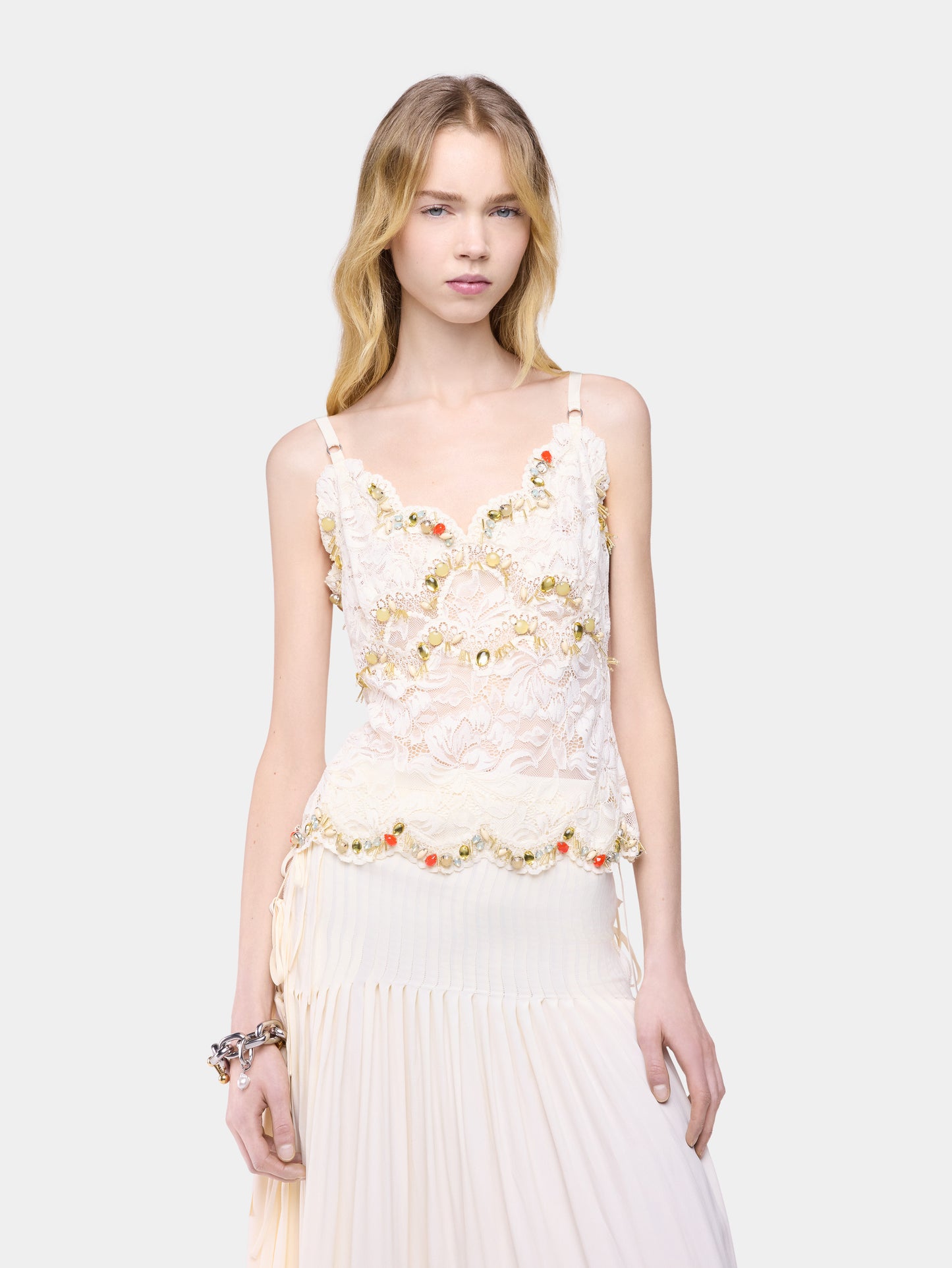 Sleeveless top in off white hand embroidered lace