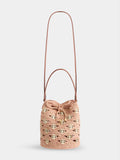 Medium bucket bag in natural raphia and peach with gold signature969 discs packshot side view 1