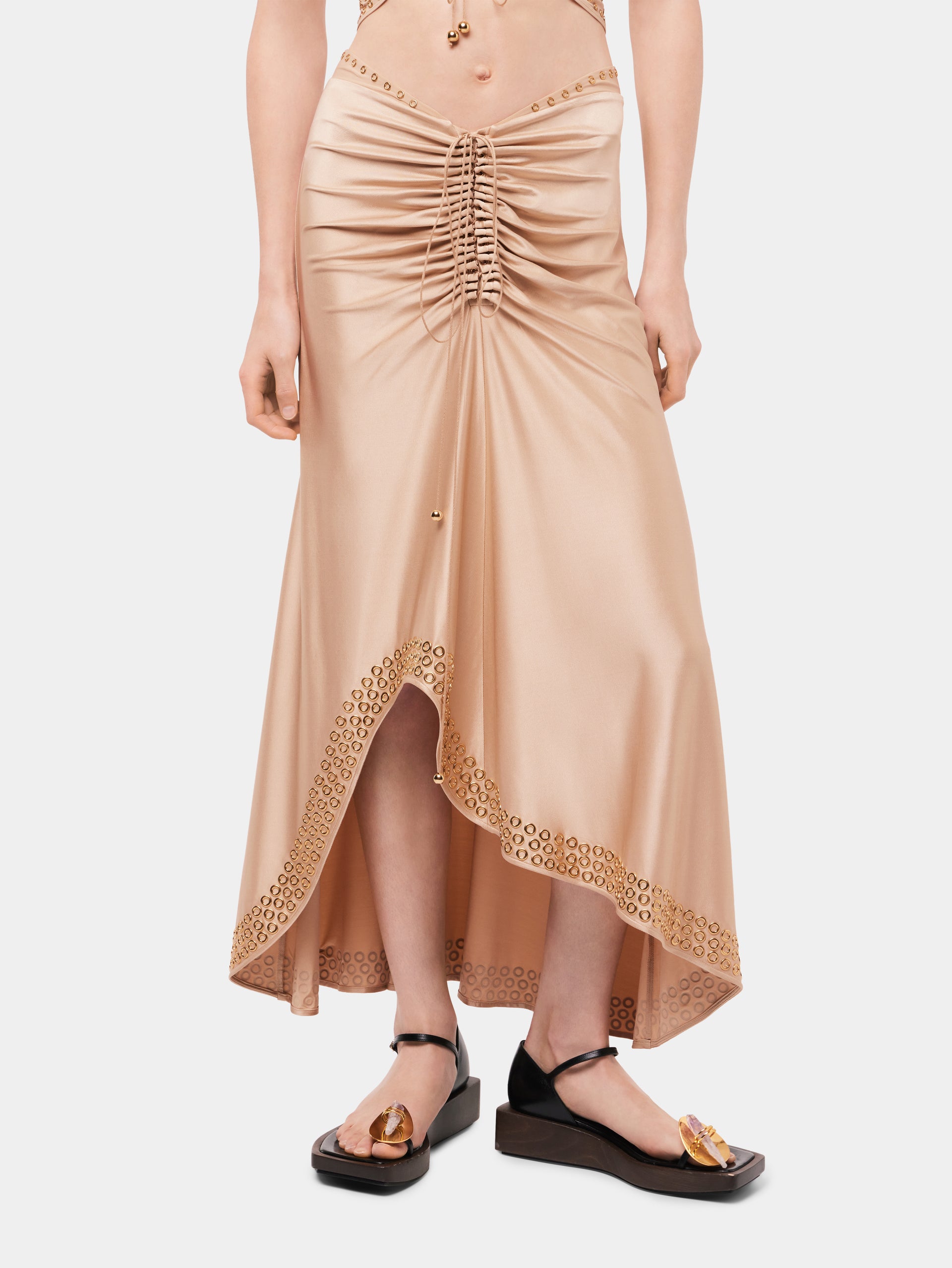 Long raffia colored skirt with embroidered metallic eyelets