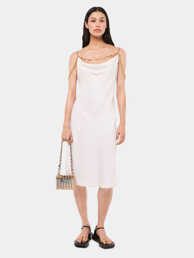 Light white dress embellished with "eight" signature chain