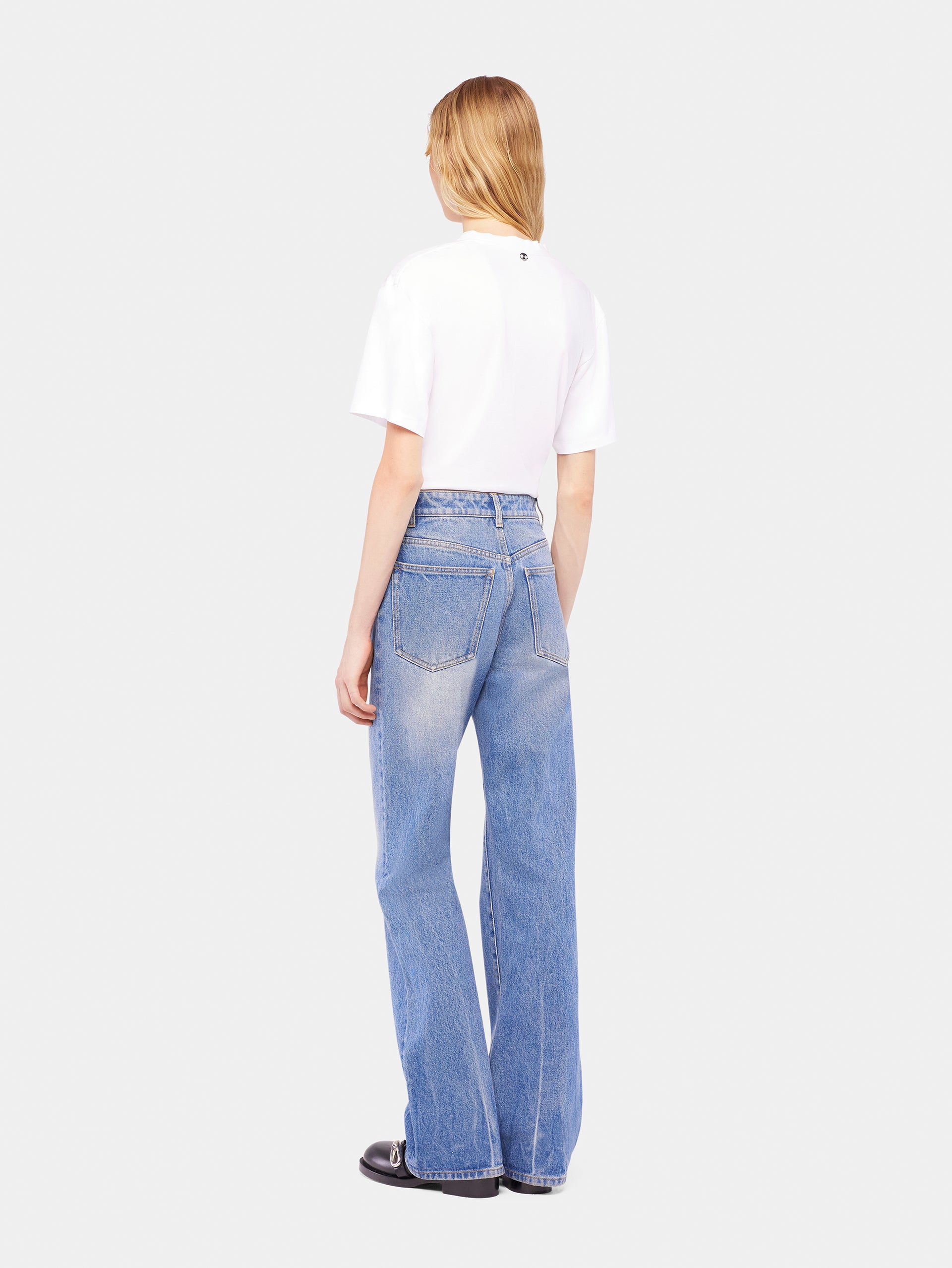 Flared jeans embellished with 1969 discs