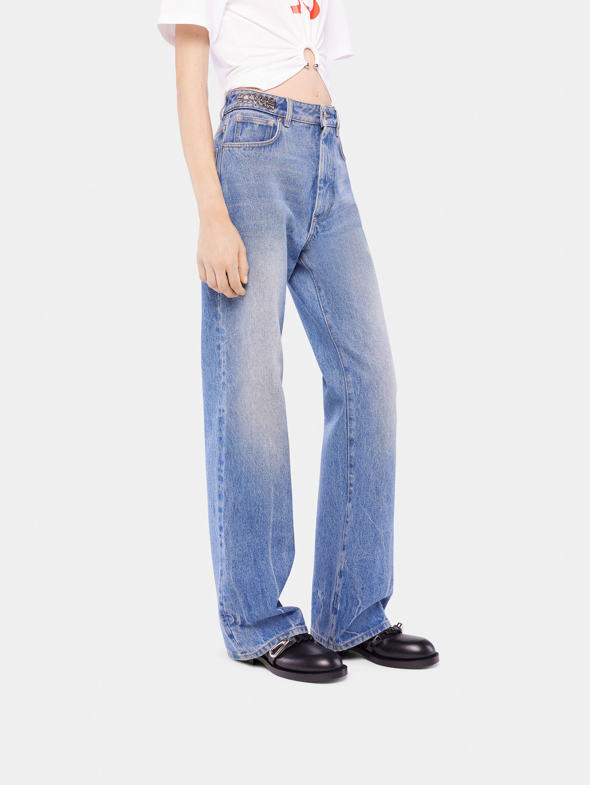 Flared jeans embellished with 1969 discs
