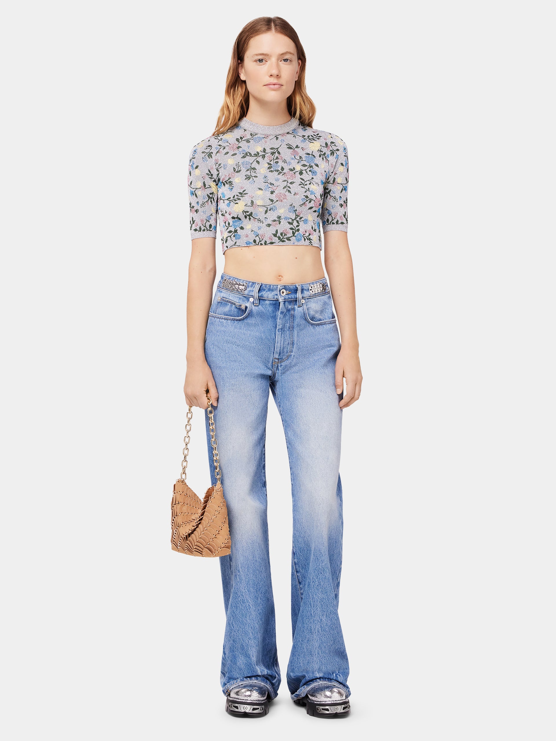 Flared jeans embellished with 1969 discs