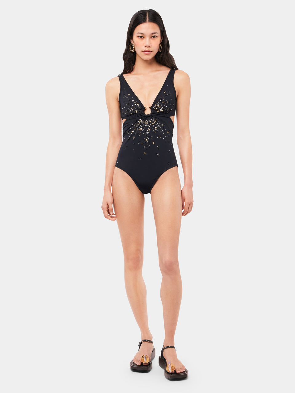Black swimsuit with cut-out details and piercing signature