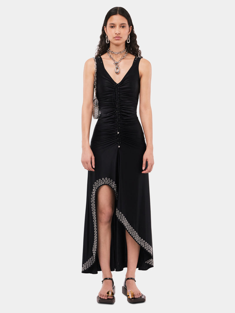Long black dress with embroidered metallic eyelets