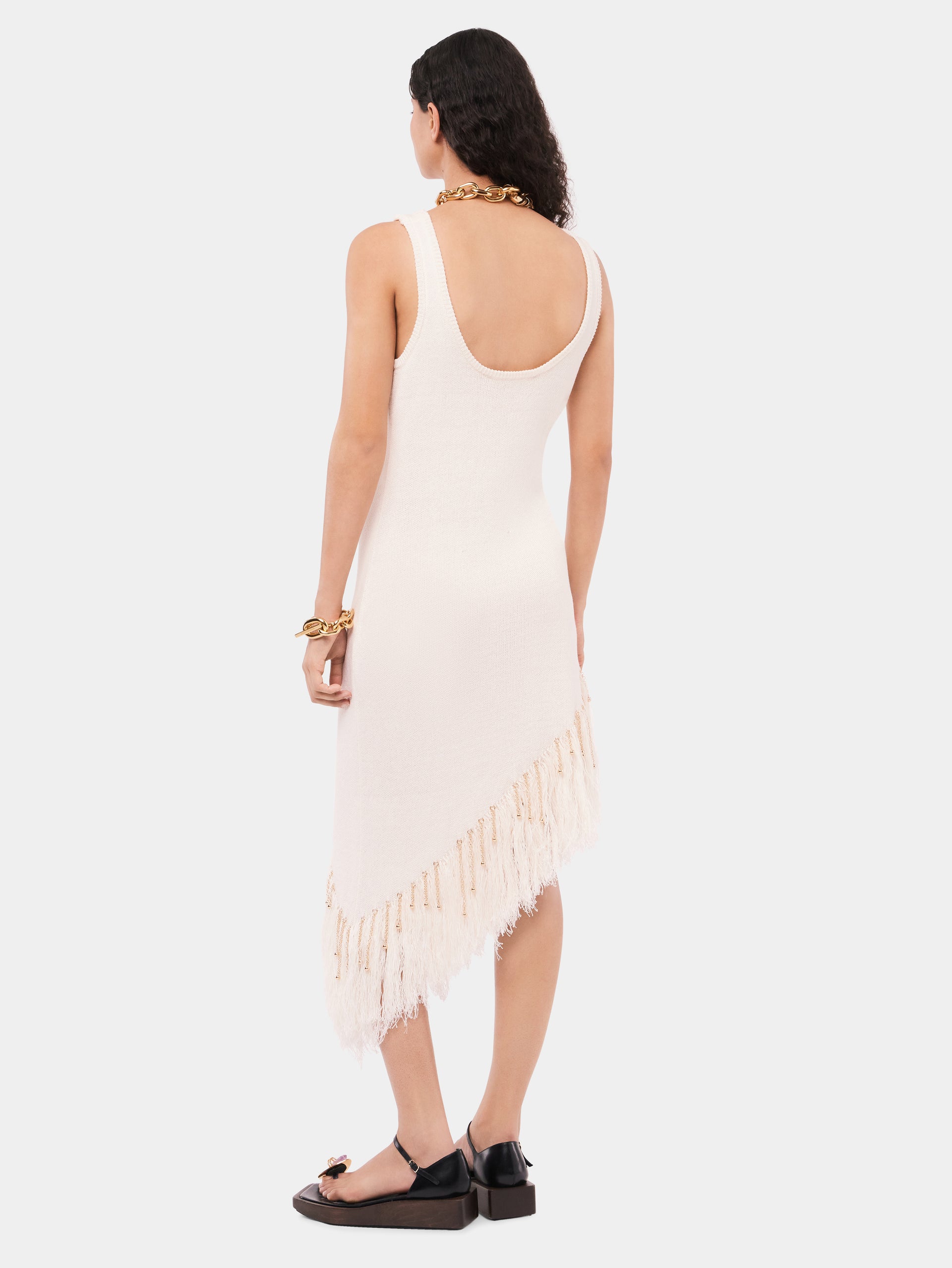Asymmetrical off white woven dress with knitted beads and feathers