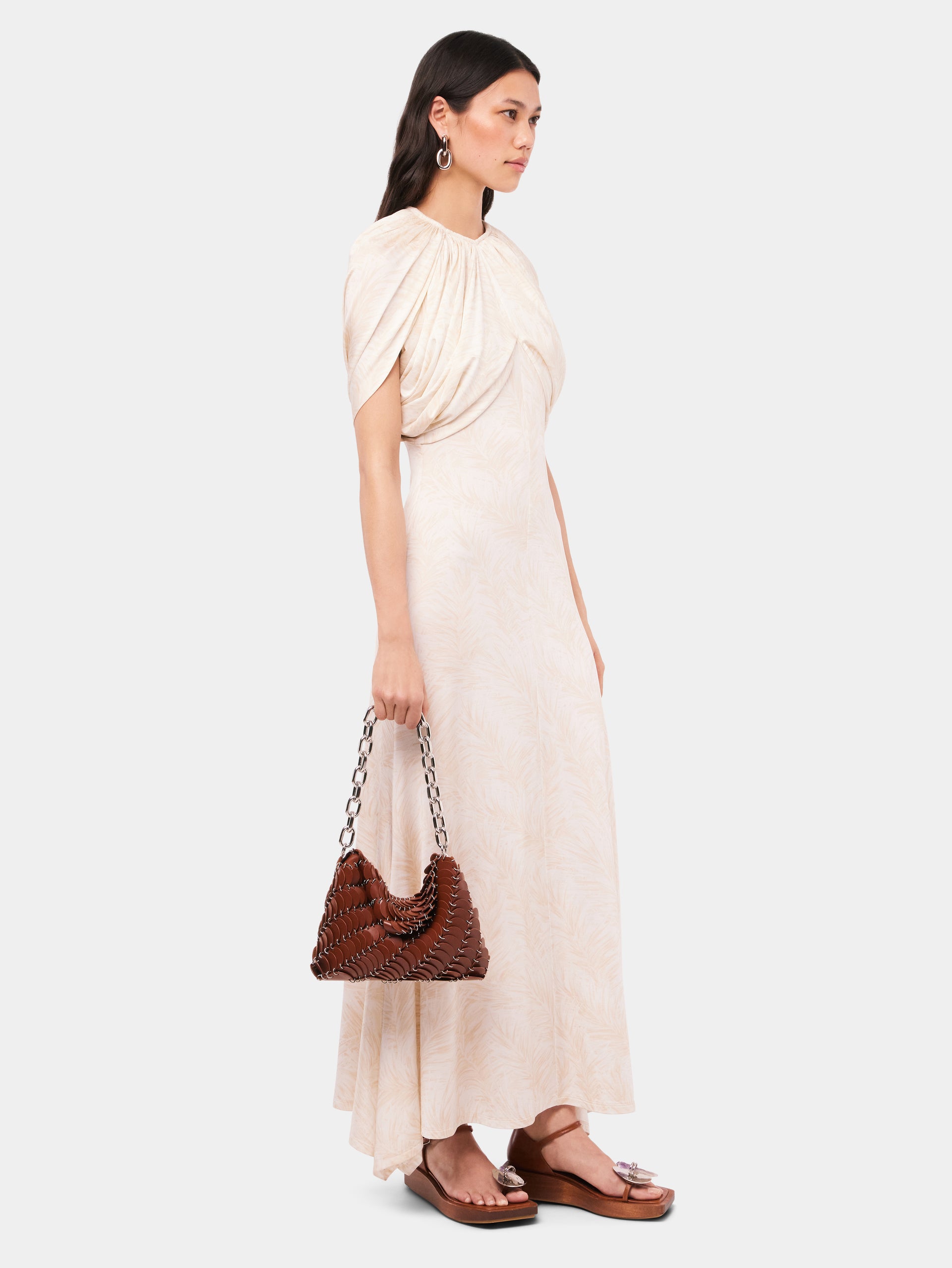Long ecru dress with feather prints and draping details