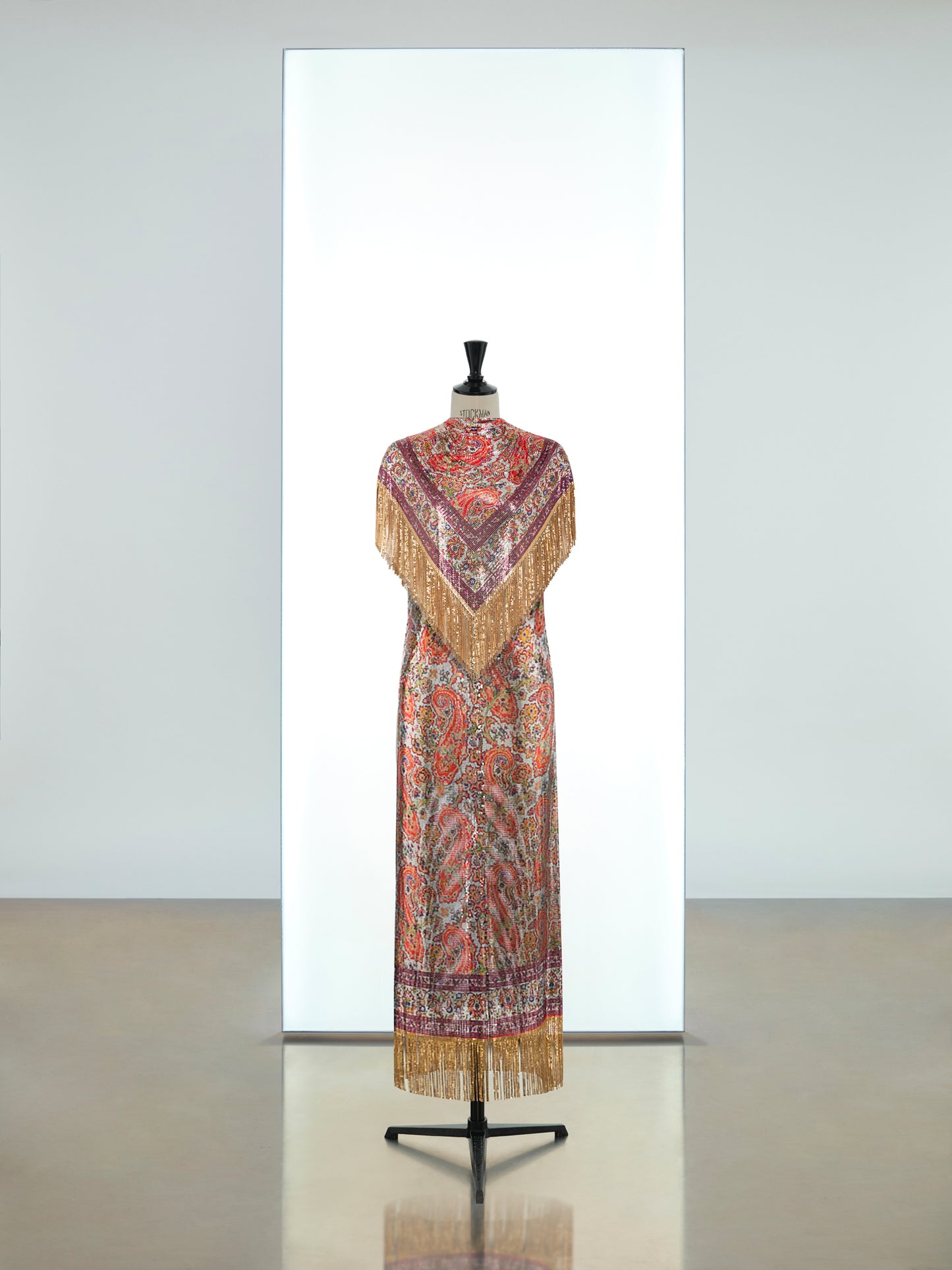 Long dress and cape top in printed iconic mesh