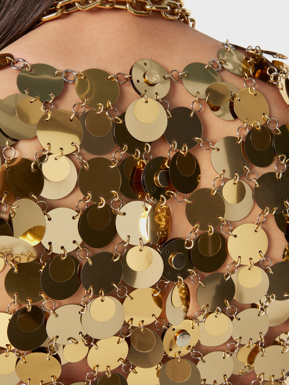 The gold sparkle discs top